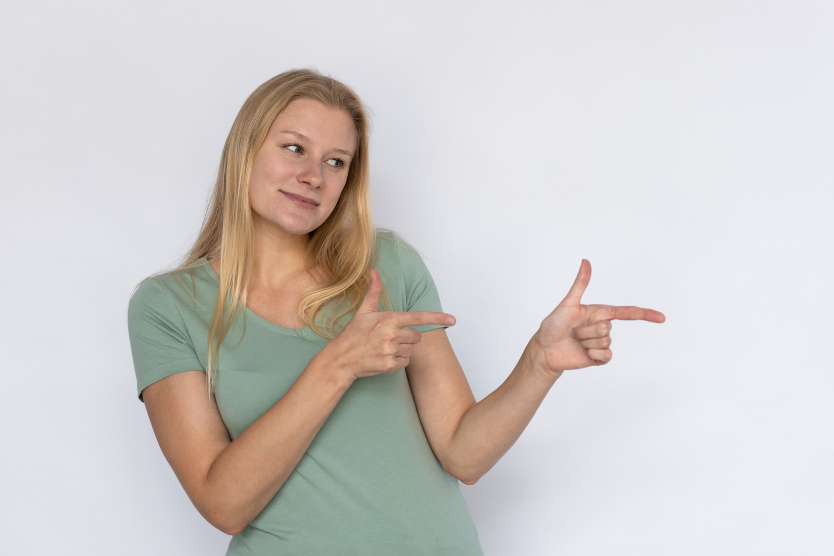 Satisfied woman pointing aside